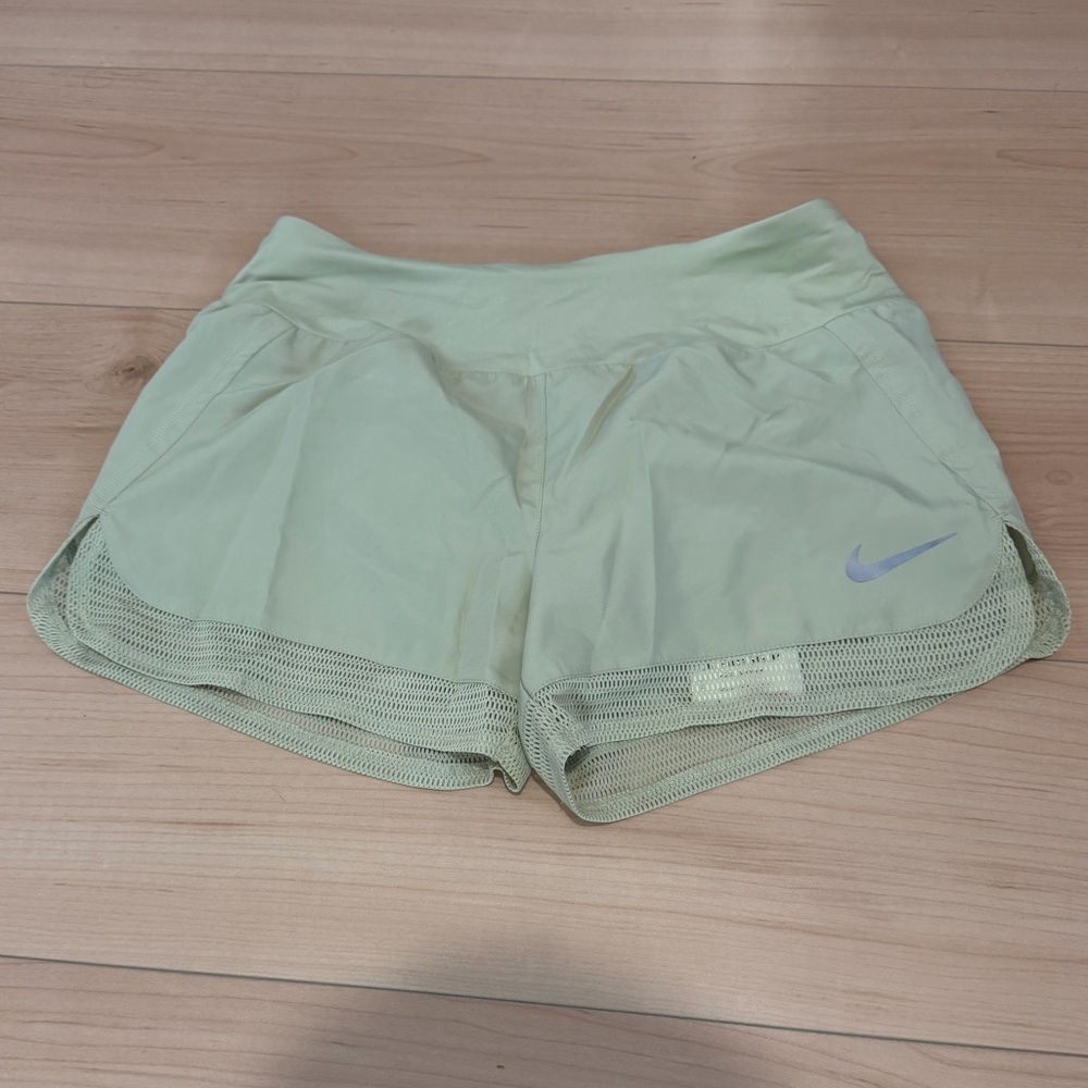 Green Nike shorts with mesh hem nwt